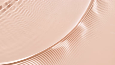 Single wave making ripples on water surface on beige bg