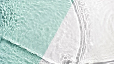 Water waves crossing and splashing against green and white bg