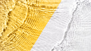 Water waves crossing and splashing on yellow and white bg