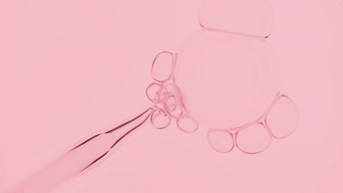 Bubbles come out from dropper and float on surface of liquid