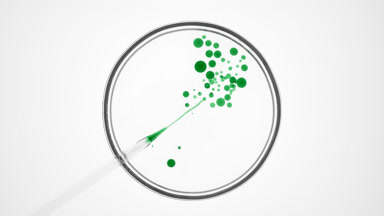 Lab dropper injects green oil into clear fluid in Petri dish