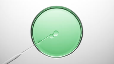 Chemical dropper injects oil into green fluid in Petri dish