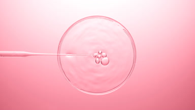 Air bubbles come out from dropper and float on clear liquid