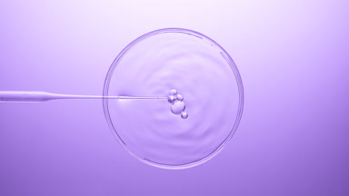 Air bubbles come out from dropper and float on clear liquid