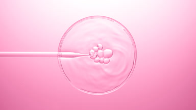 Different sized bubbles come out from dropper on liquid bursting