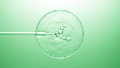Different sized bubbles come out from dropper on liquid bursting