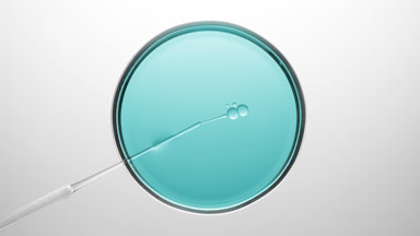 Chemical dropper injects oil into cyan liquid in Petri dish