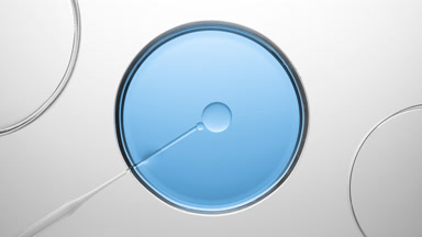 Dropper injects oil into blue fluid in one of three Petri dishes