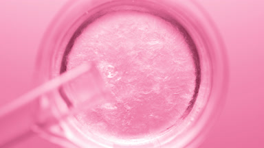 Glycerin pouring into beaker with water creates ripples