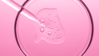 Gel with tiny bubbles comes out from dropper into Petri dish