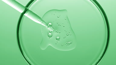 Gel with tiny bubbles comes out from dropper into Petri dish