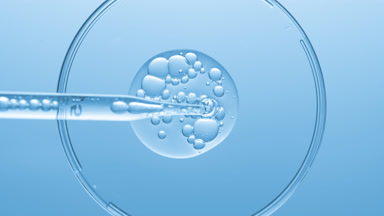 Gel with bubbles comes out from lab dropper into Petri dish