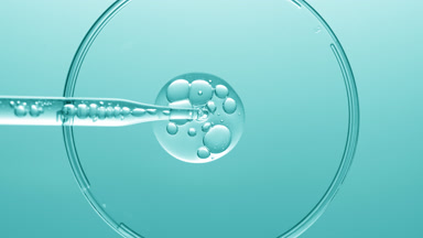 Gel with bubbles comes out from lab dropper into Petri dish