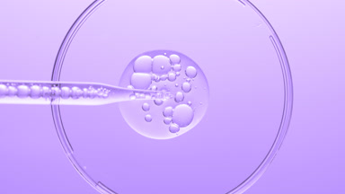 Gel with bubbles comes out from lab dropper into Petri dish