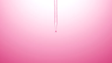 Clear liquid is dripped from graduated chemical dropper
