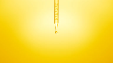 Clear fluid is dripped from graduated chemical dropper