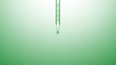 Clear fluid is dripped from graduated chemical dropper