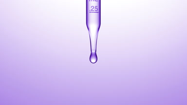 Transparent fluid is dripped from graduated lab dropper