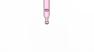 Pink drop is falling down from chemical dropper