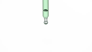 Green drop is falling down from chemical dropper