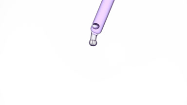 Drop of purple transparent liquid is falling down from dropper