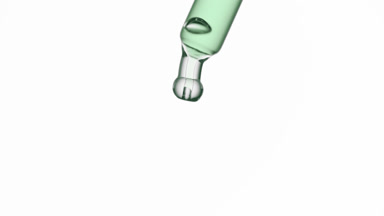 Green drop is falling down from lab dropper