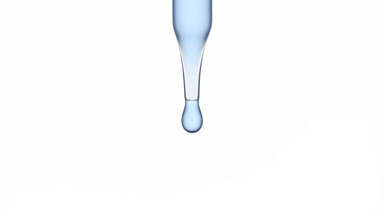 Blue drops are falling down from chemical dropper