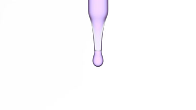 Purple drops are falling down from chemical dropper