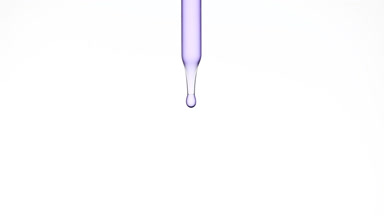 Drops of violet clear fluid are falling down from lab dropper