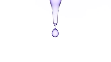 Drops of purple clear liquid are falling down from lab dropper