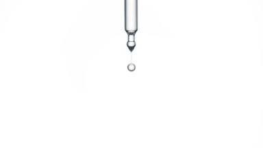 Drop of hyaluronic acid is falling down from lab dropper