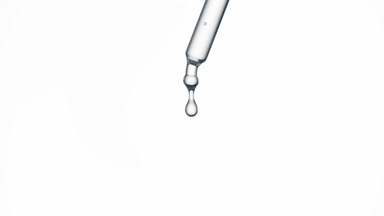 Drop of grey fluid is falling down from pipette