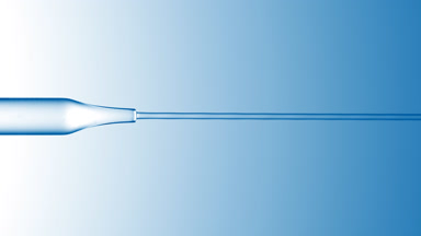 Transparent liquid is flowing from chemical dropper