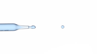 Blue fluid flows from graduated lab dropper