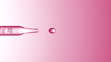 Clear drops are dripped from graduated lab dropper