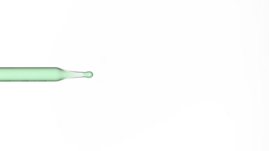 Green drop is dripping from lab dropper