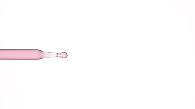 Rose oil is dripping from lab dropper