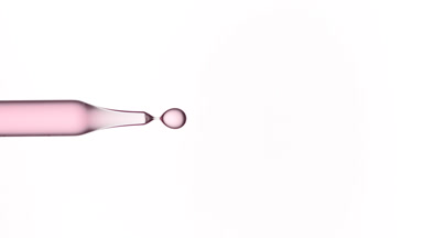 Drop of rose water is dripped from pipette
