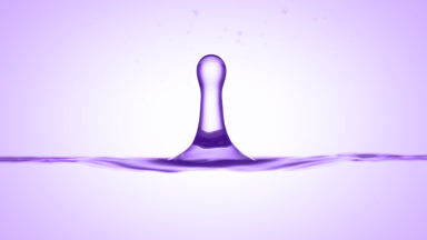 Drop of acai extract falls on purple liquid creating ripples
