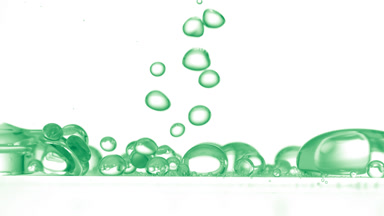 Green bubbles falling down to another ones on white background