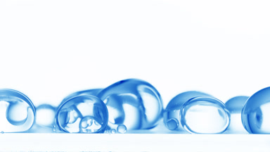 Blue bubbles falling down to another ones on white background