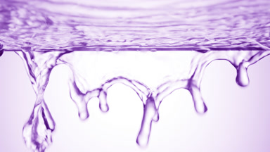 Violet liquid is flowing down from glass surface