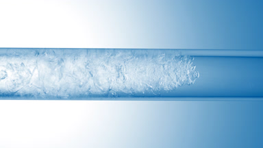 Glycerin is pouring in glass tube with transparent fluid