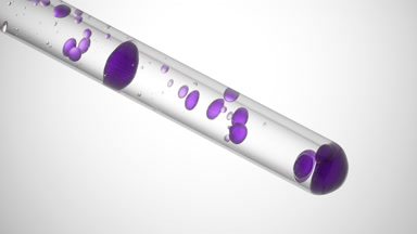 Violet liquid is pouring in test tube with transparent one