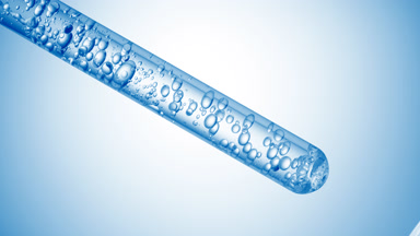 Hyaluronic acid is injected in test tube creating bubbles