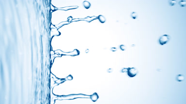 Blue liquid flows from liquid surface on pale blue background