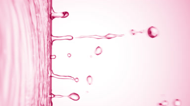 Pink liquid flows from liquid surface on pale pink background