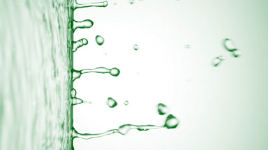 Green liquid flows from liquid surface on green background