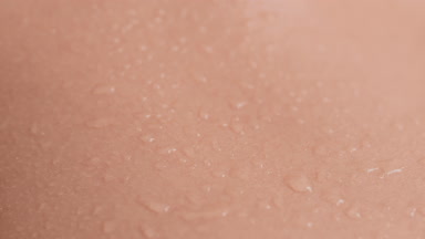 Extreme close-up shot of good-looking healthy wet moving skin
