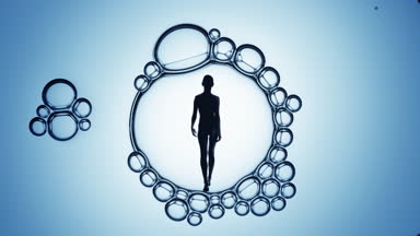 Woman's silhouette inside macro bubble on blue background